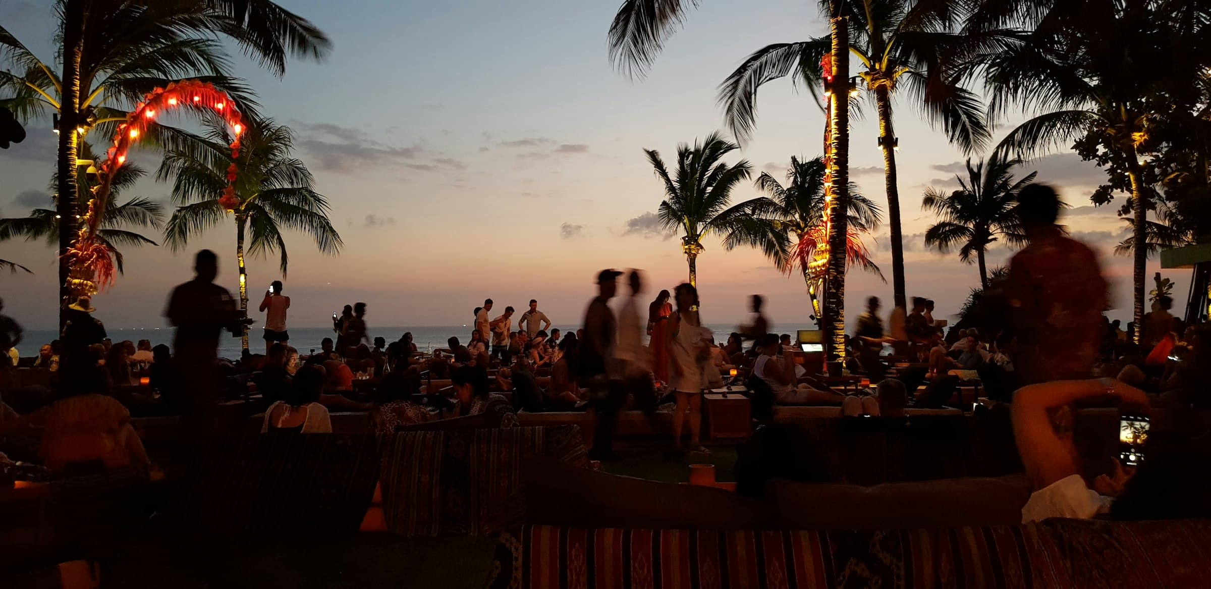 Sunset on the Seminyak beach: the beach club's after-hours service window.